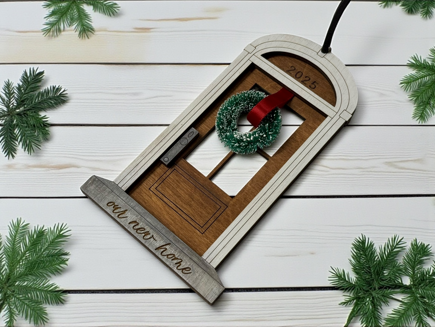 Decorative door ornament with wreath on a wooden background